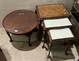 Walnut finish nest of three tables with glass top and a circular mahogany side table (saleroom