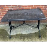 A metal framed garden table with woven effect top,