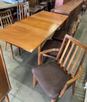 A teak extending dining table together with five G-Plan dining chairs (one carver),