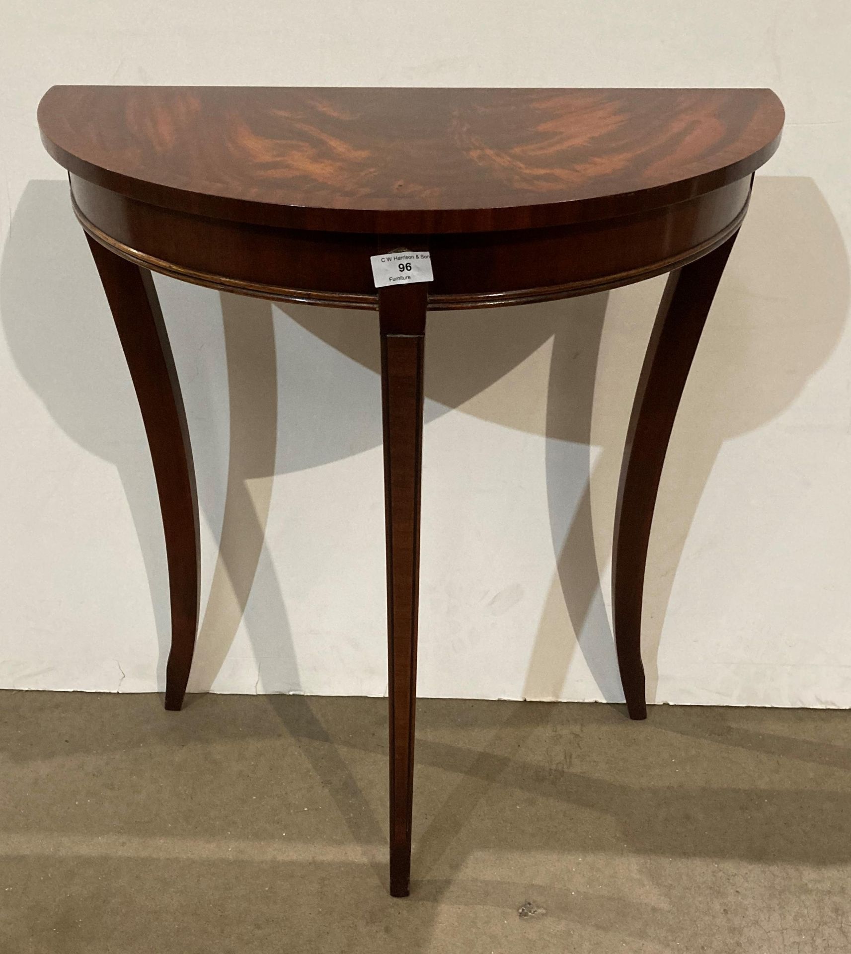 A Reprodux mahogany half-moon hall table (saleroom location: MA7)