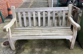 A wood garden bench,