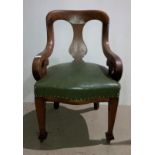 An oak armchair with green leather-finish seat and open scroll arms (saleroom location: S2 QA02)