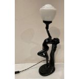 Reproduction Art Deco black resin table lamp with glass shade,