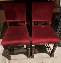 A set of four oak dining chairs with burgundy upholstery (saleroom location: MA6)