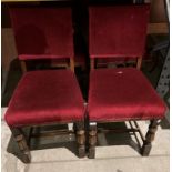 A set of four oak dining chairs with burgundy upholstery (saleroom location: MA6)