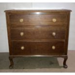 An oak three-drawer chest of drawers on cabriole legs,