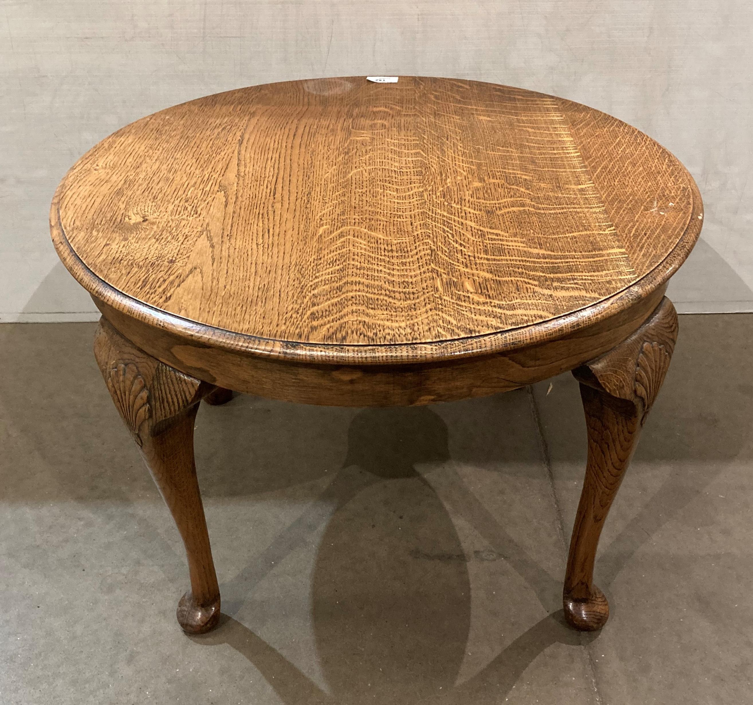 An oak side/coffee table on cabriole legs,