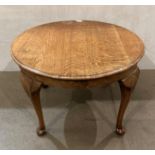 An oak side/coffee table on cabriole legs,