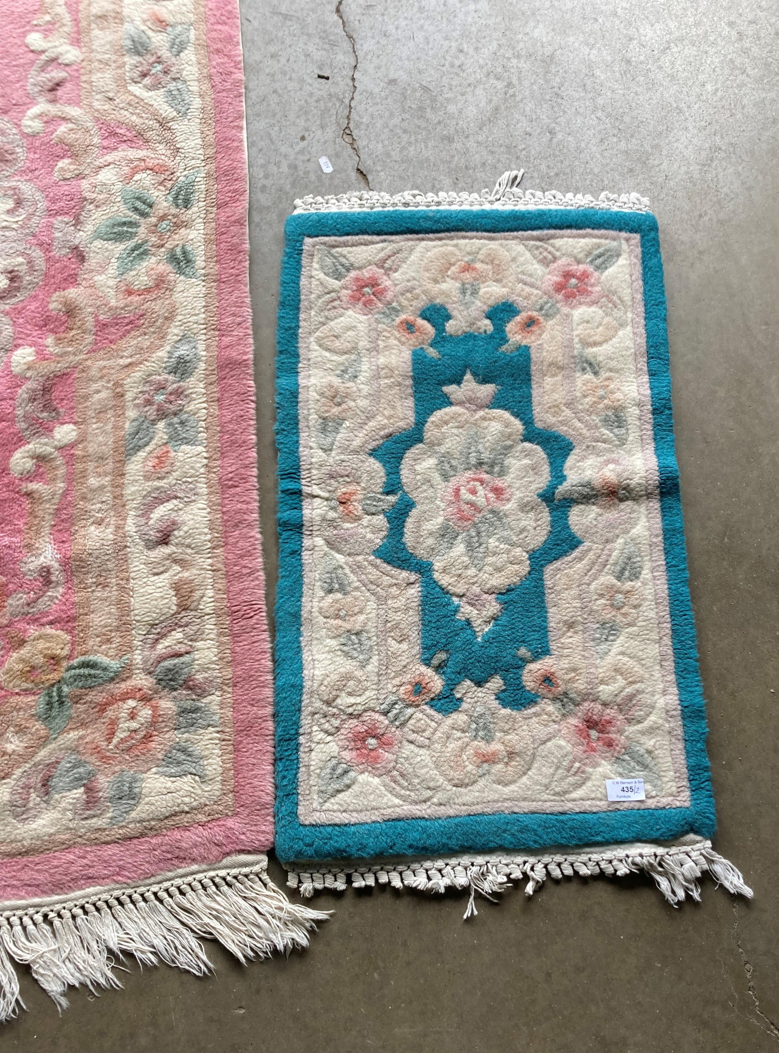 Two Chinese-style rugs - pink pattern (150 x 75cm) and blue pattern (75 x 45cm) (saleroom location: - Image 3 of 4
