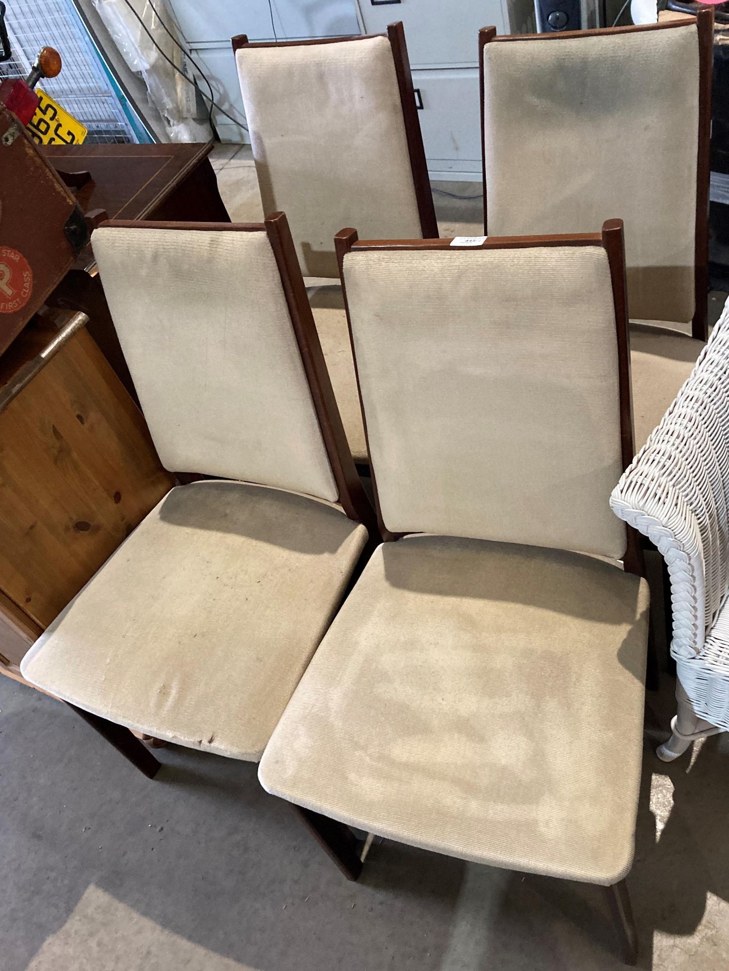 Set of four teak framed dining chairs with beige cloth seats (saleroom location: MA6)