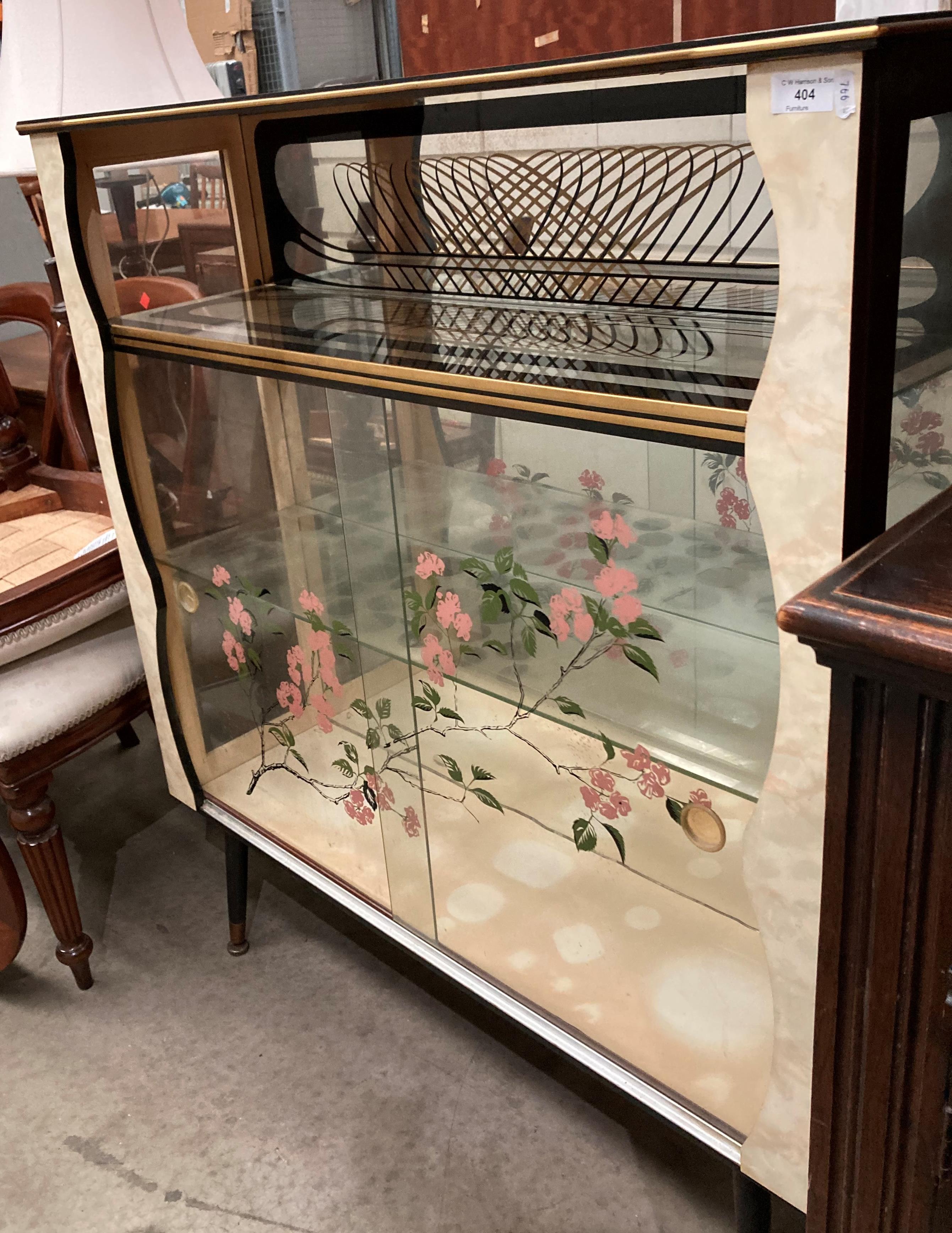 A 1950s/60s melamine and glass display cabinet,