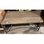 A metal framed wood topped with glass insert coffee table,