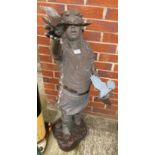 A brown coloured composite statue of a young girl holding birds (120cm high) - sold as seen with