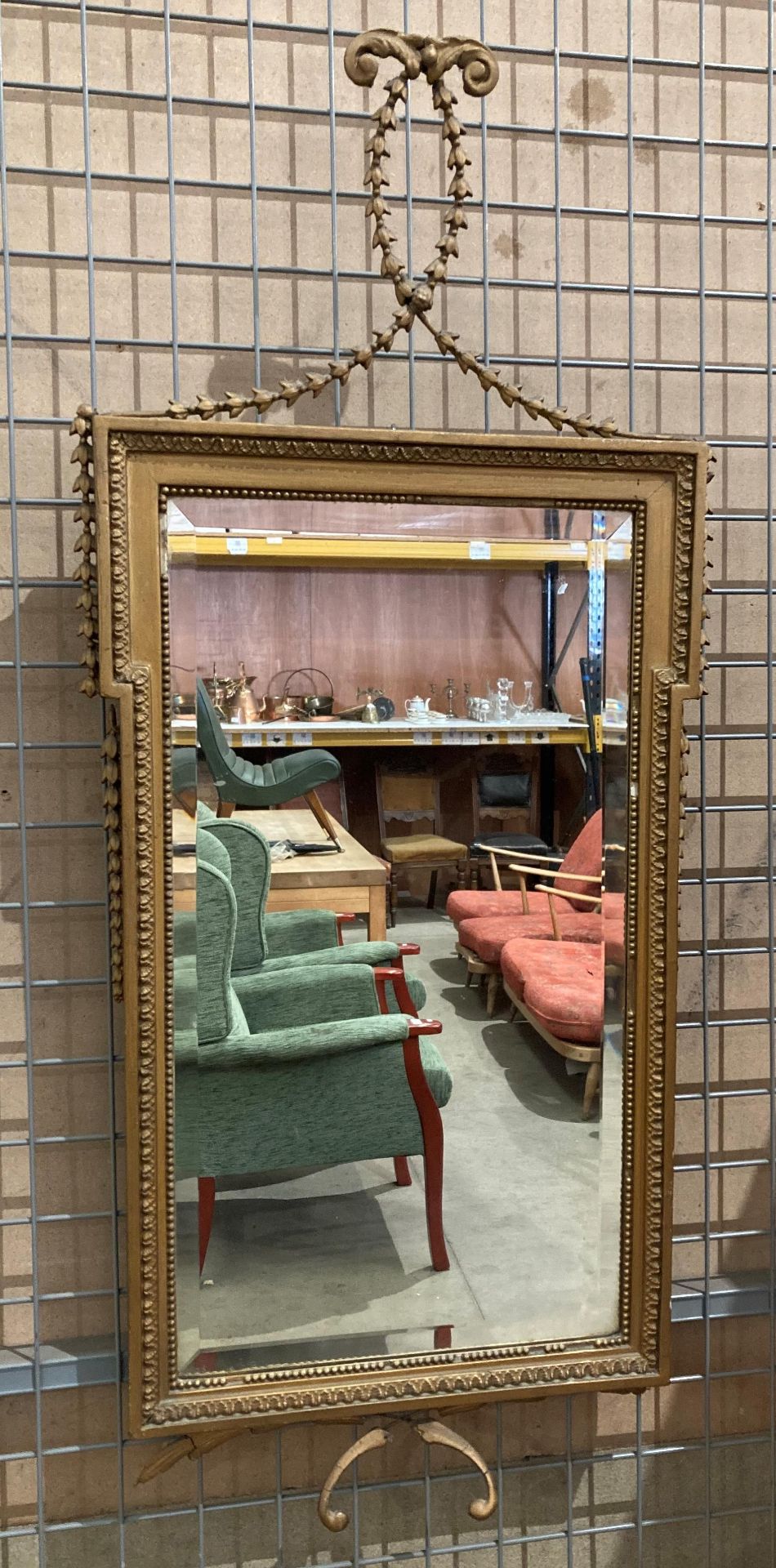 Gilt framed wall mirror with detailed beading,