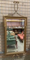 Gilt framed wall mirror with detailed beading,