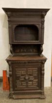 A Victorian oak wall cupboard with single-door top section with griffin supports,