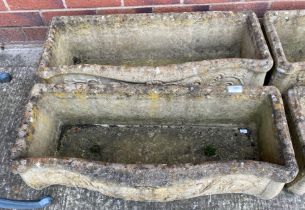 Two composition stone curved-front troughs,