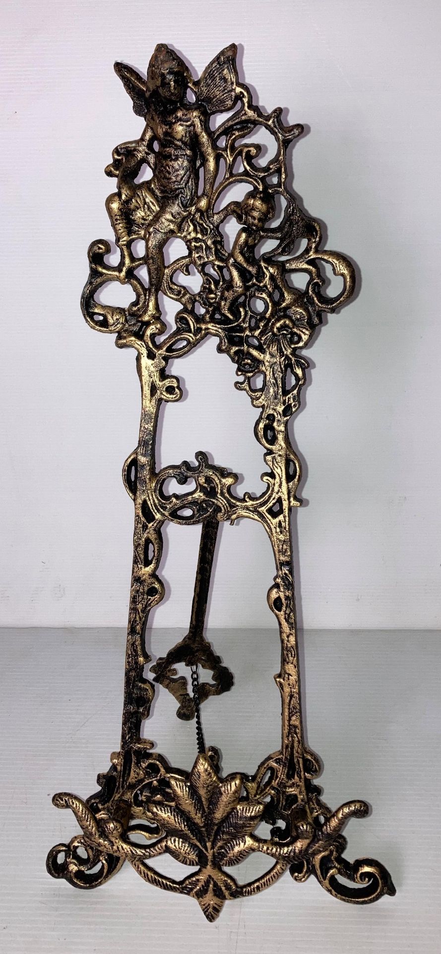 A mahogany Georgian-style wall mirror with brass phoenix/eagle to top (63cm x 48) and a cast metal - Image 3 of 3