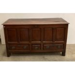 An antique oak mule chest/coffer with lift-up lid and three drawers (one small,