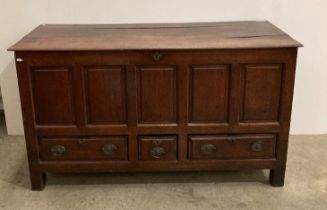 An antique oak mule chest/coffer with lift-up lid and three drawers (one small,