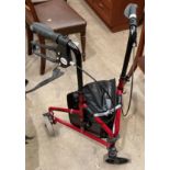 A Drive Devilbiss Health Care Ltd red metal three-wheel folding mobility aid (saleroom location: