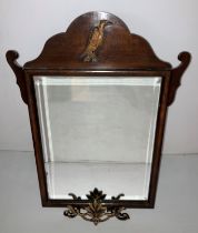 A mahogany Georgian-style wall mirror with brass phoenix/eagle to top (63cm x 48) and a cast metal