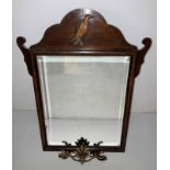 A mahogany Georgian-style wall mirror with brass phoenix/eagle to top (63cm x 48) and a cast metal