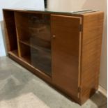 Mid-Century teak storage unit by Castle Furniture with single door and three glass sliding doors