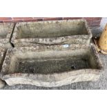 Two composition stone curved-front troughs,