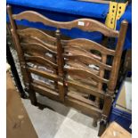 A Heal & Son London oak single bed-head and base-board with metal spring mattress (saleroom