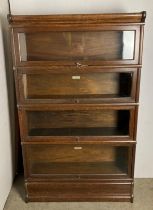 A Mid-Century four-section Globe Wernicke with base section and label bookcase 87cm x 142cm high