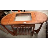 A teak coffee table with glass-top extending leaves (please note: one leg damaged),