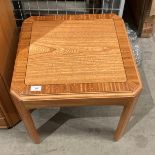 A William Lawrence light wood finish square coffee table,