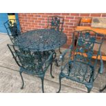 A green painted aluminium garden patio set comprising circular table (100cm diameter) and four