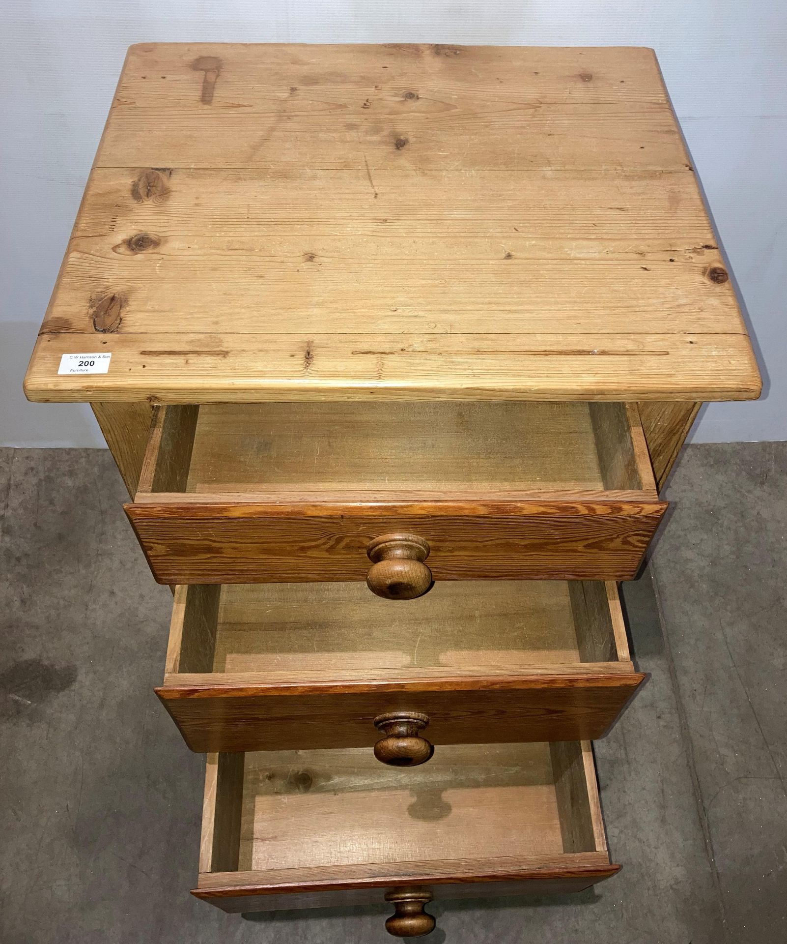 A stripped pine large three-drawer bedside unit, - Image 2 of 2