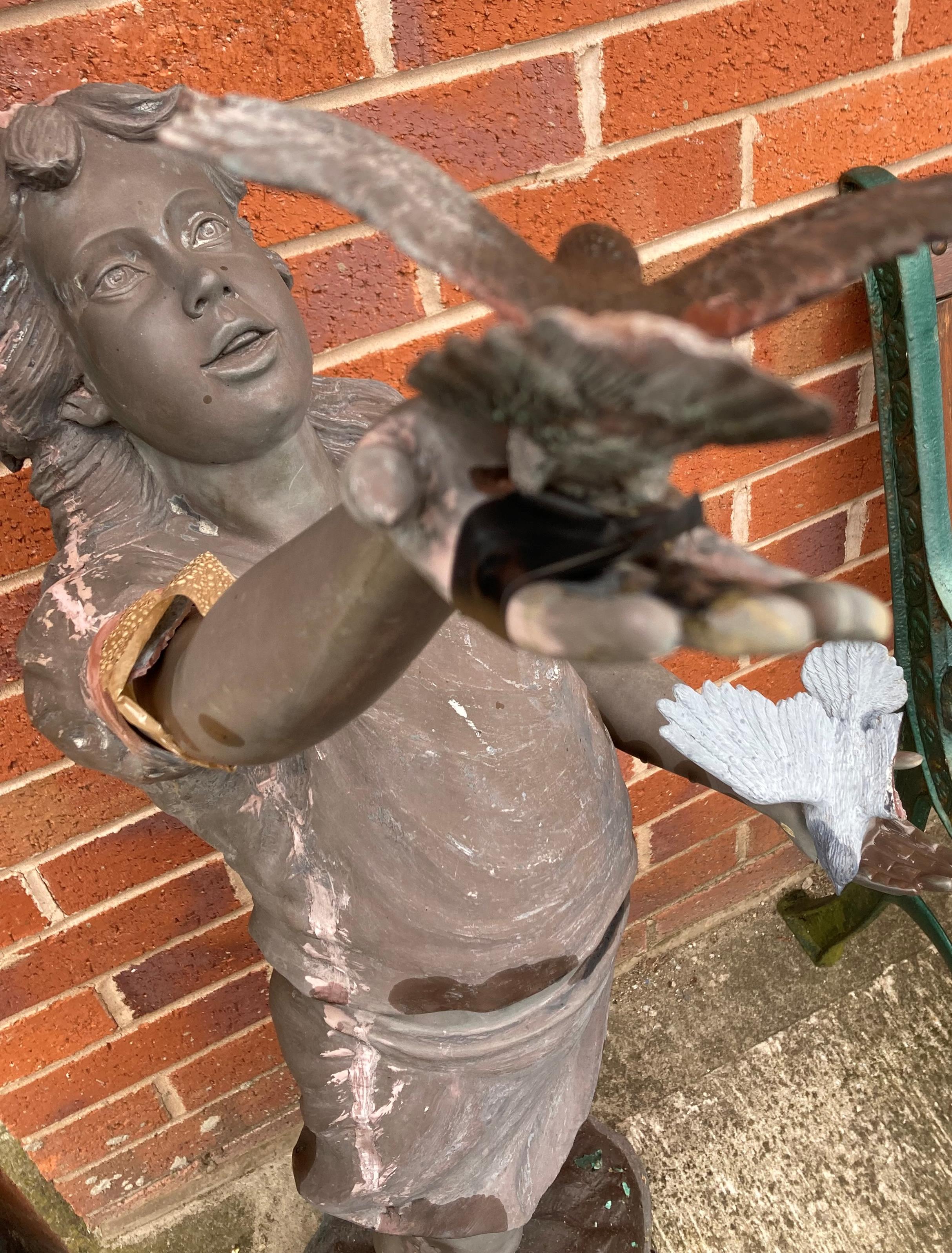 A brown coloured composite statue of a young girl holding birds (120cm high) - sold as seen with - Image 3 of 4