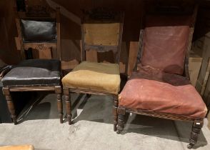 Pair of mahogany lounge chairs with carved top and turned legs and a matching high back chair with