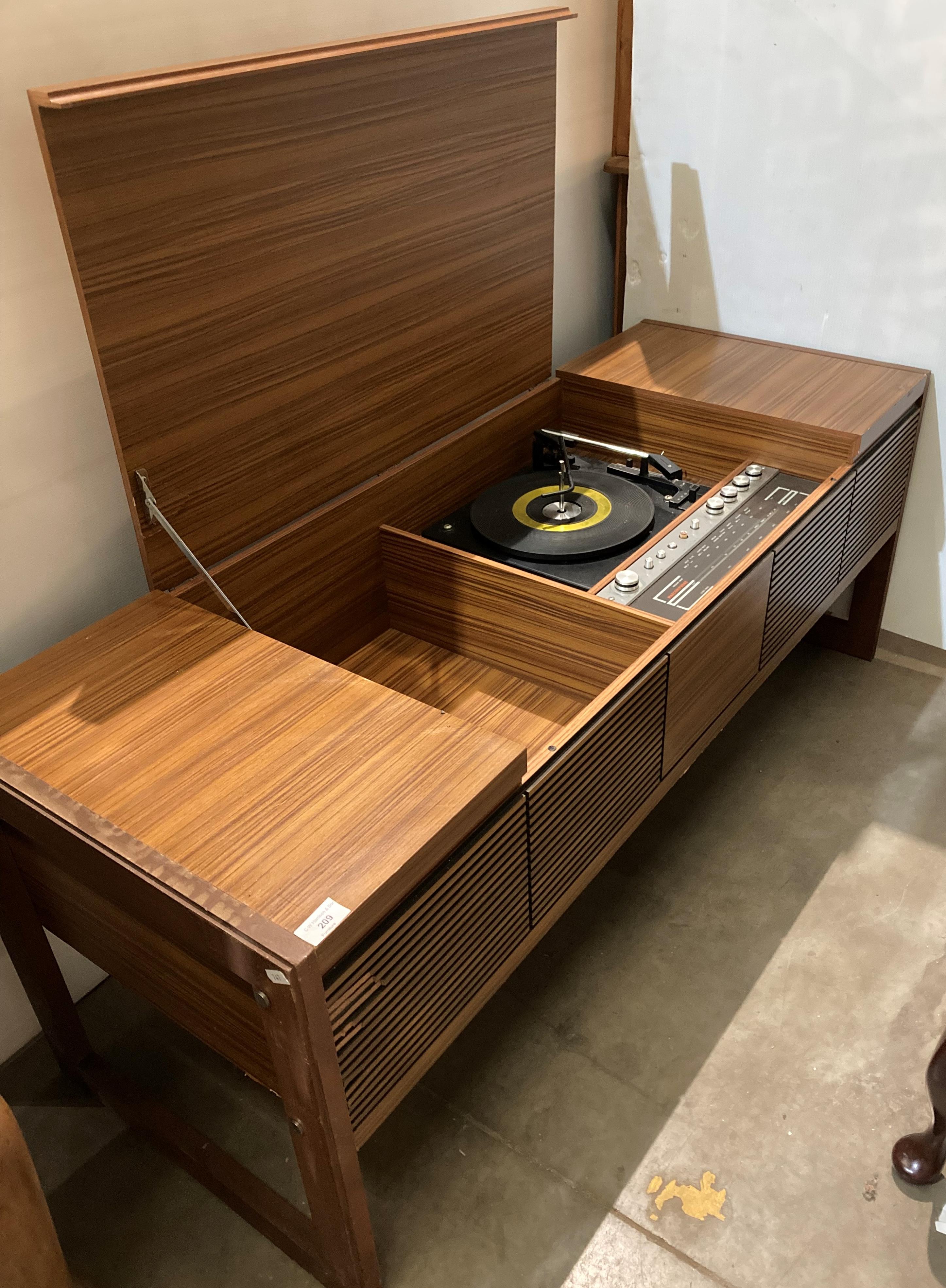 A teak finish Marconi Phone radiogram with deck and multi-band radio (failed PAT test),