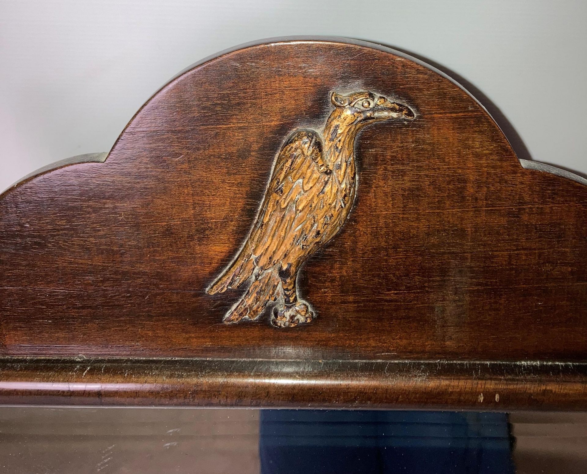 A mahogany Georgian-style wall mirror with brass phoenix/eagle to top (63cm x 48) and a cast metal - Image 2 of 3