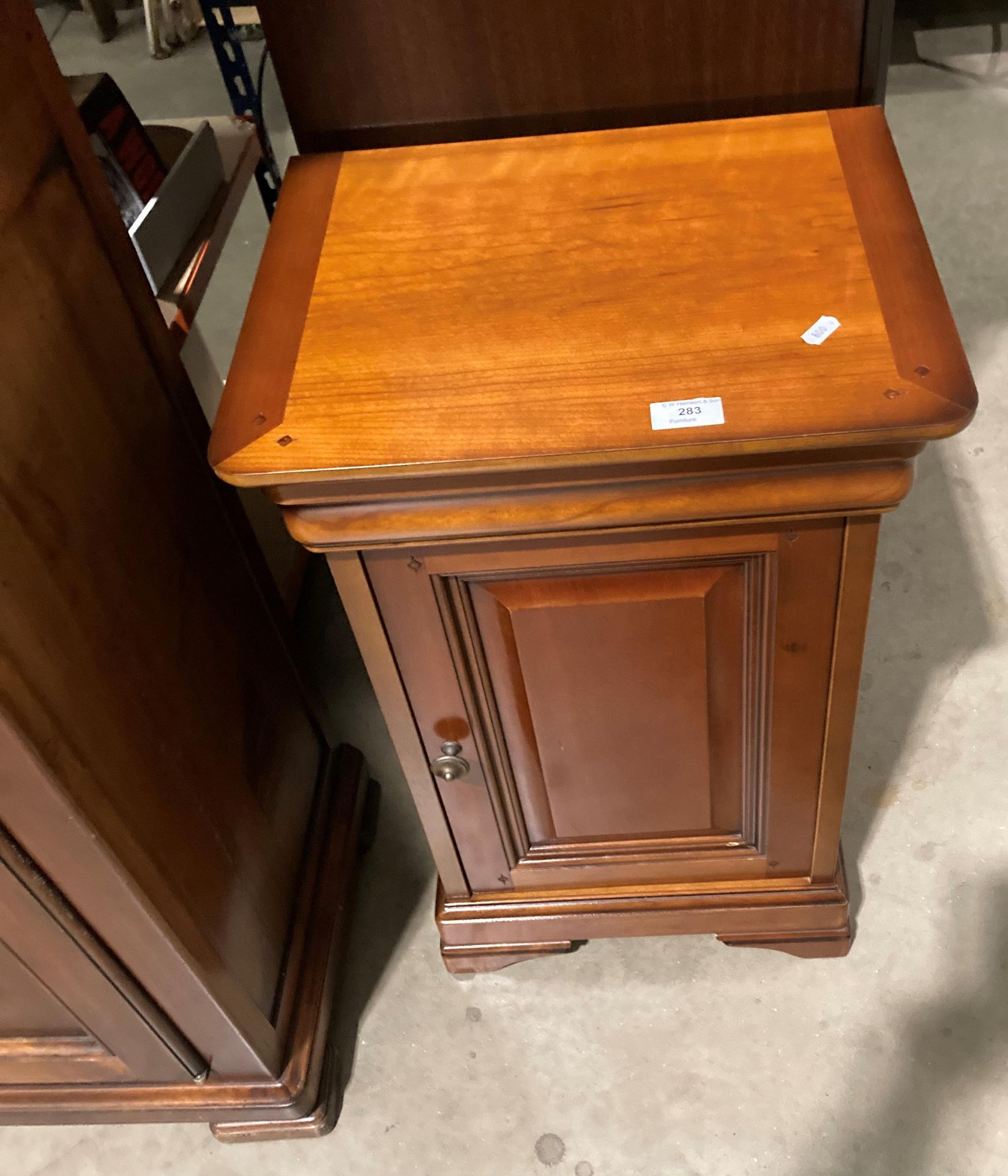 A stained wood single door bedside cupboard (saleroom location: S2 blue & orange rack)