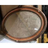 An Edwardian carved wood oval wall mirror - with damages (saleroom location: MA7)