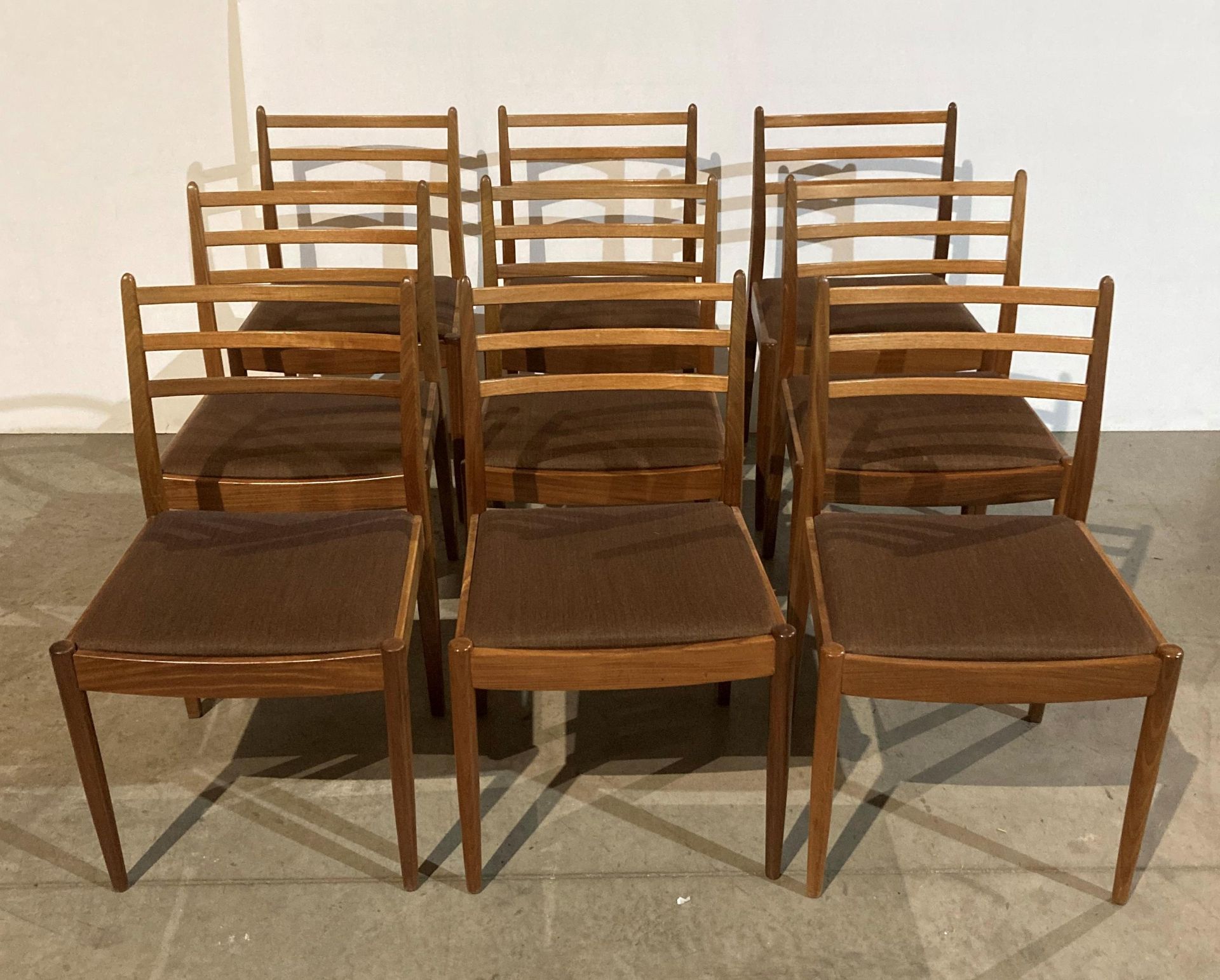 Set of nine Mid Century teak G-Plan dining chairs by VB Wilkins with brown fabric seats (saleroom