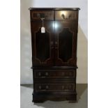 Mahogany three-door lift-top music cabinet with inlay together with a Sony music system,