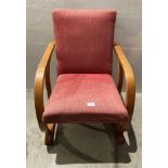 A vintage Art Deco Bentwood armchair believed to be 'Heals' with light red fabric upholstery