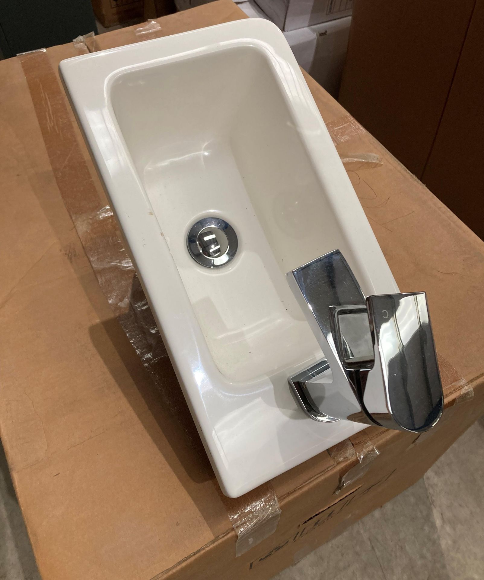 Resin hand wash basin 40cm x 22cm complete with pop up waste and tap (saleroom location: RB)