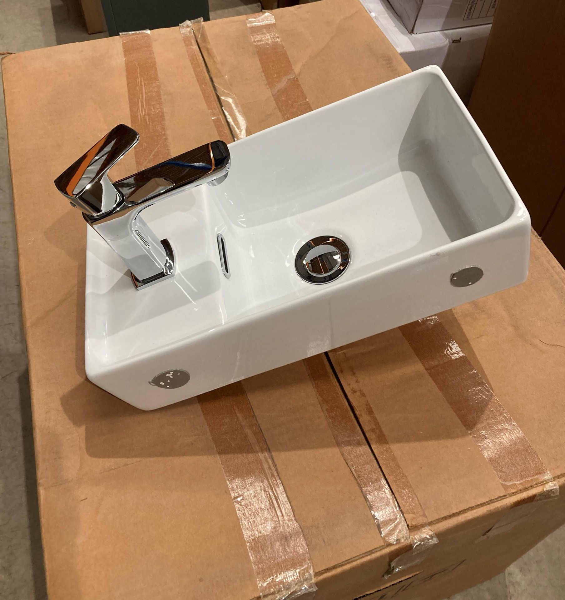 Ceramic hand wash basin 40cm x 22cm complete with pop up waste and tap (saleroom location: RB)