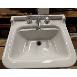 Ceramic wash basin 60cm x 55xm complete with incomplete taps (saleroom location: RB)