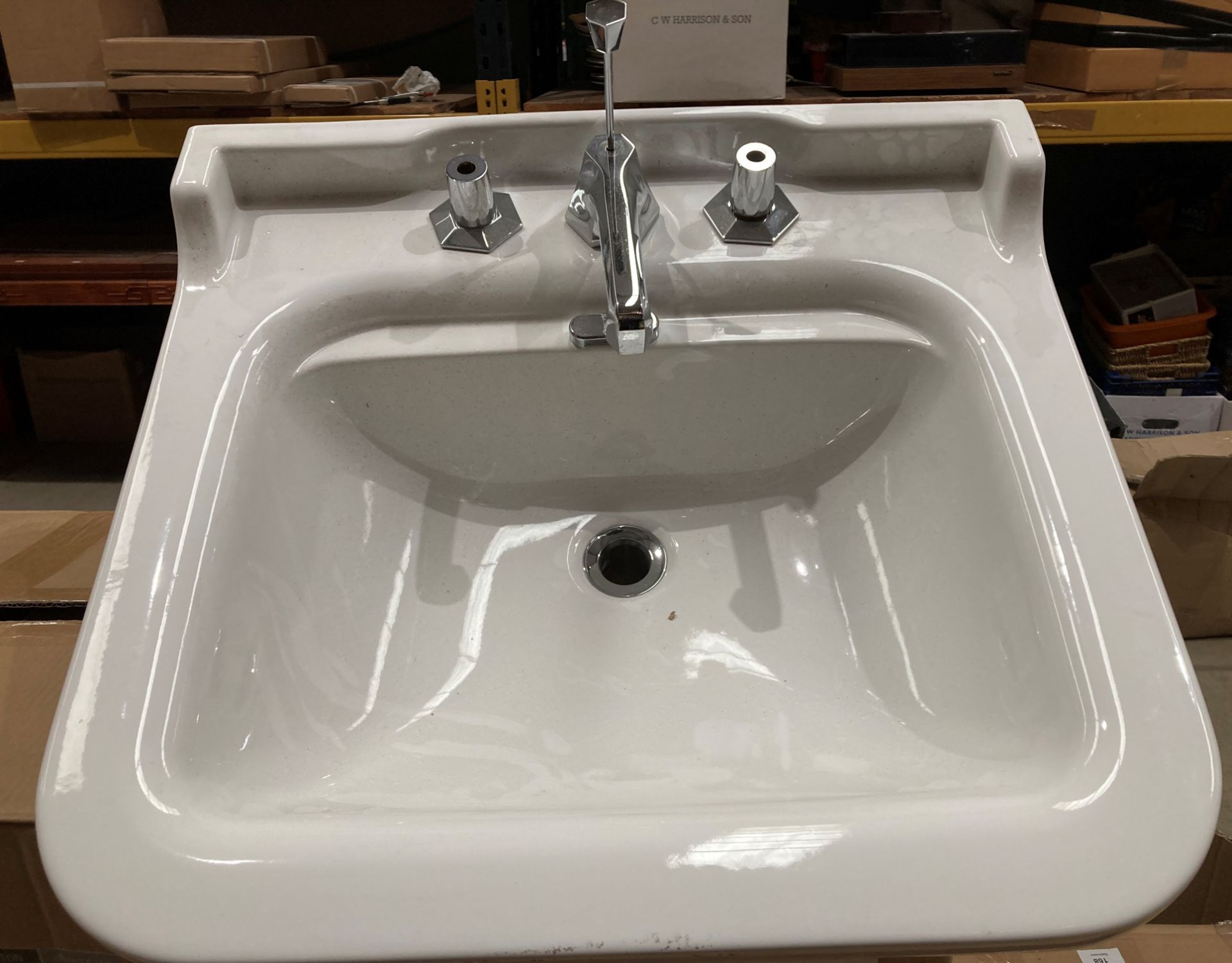 Ceramic wash basin 60cm x 55xm complete with incomplete taps (saleroom location: RB)