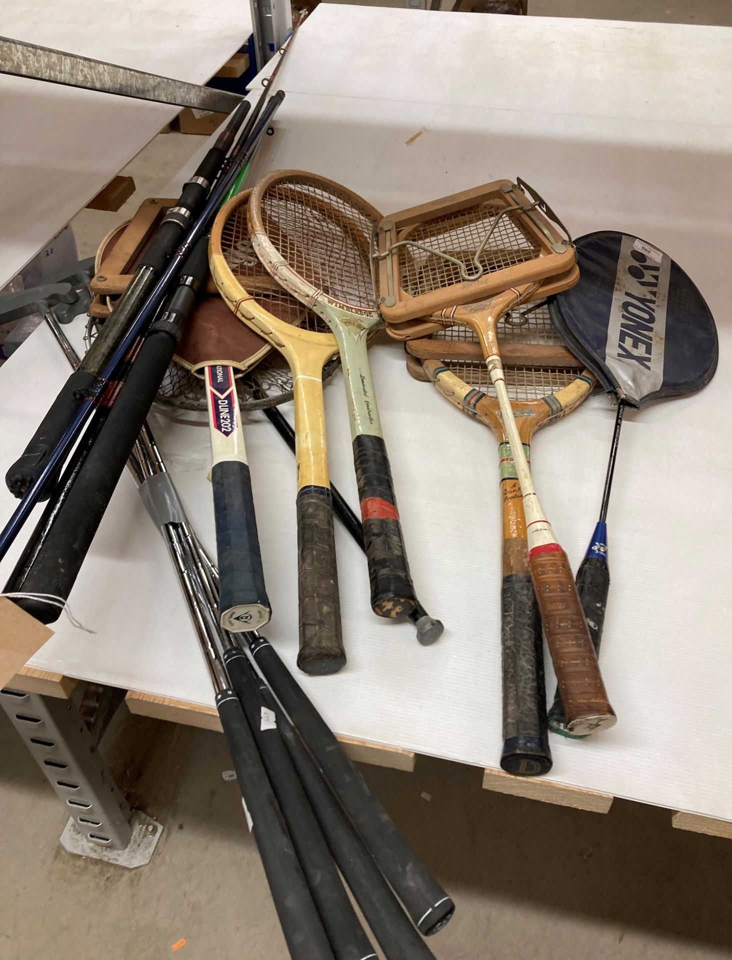 7 x tennis rackets, 4 x Golf putters and 2 x fishing rods,