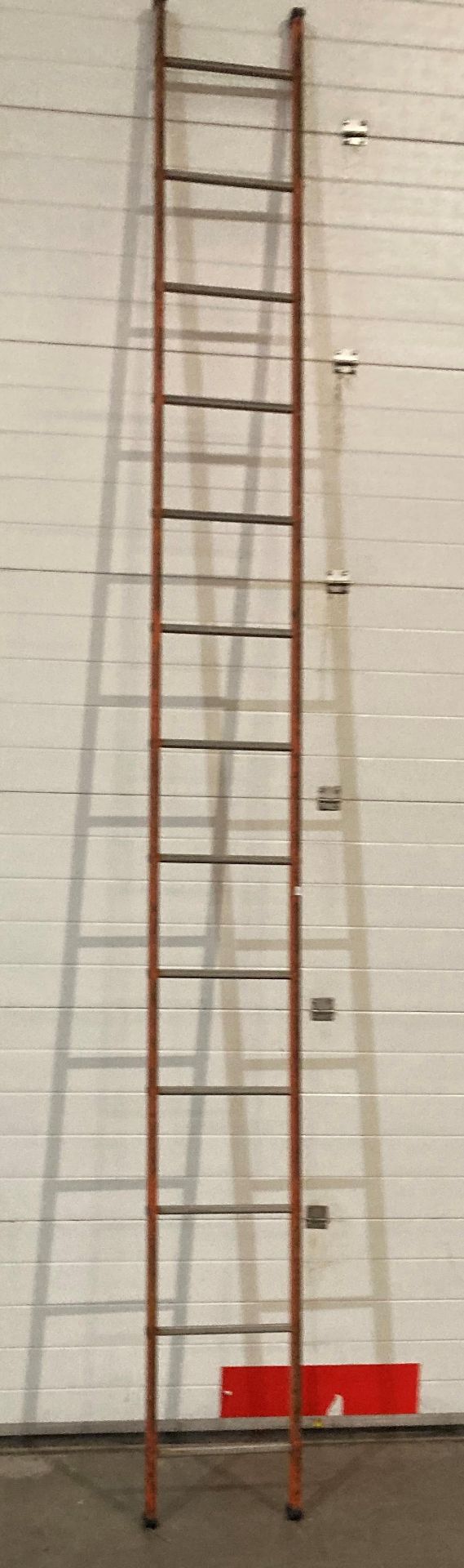 Orange painted 12 rung ladder (saleroom location: RD2)